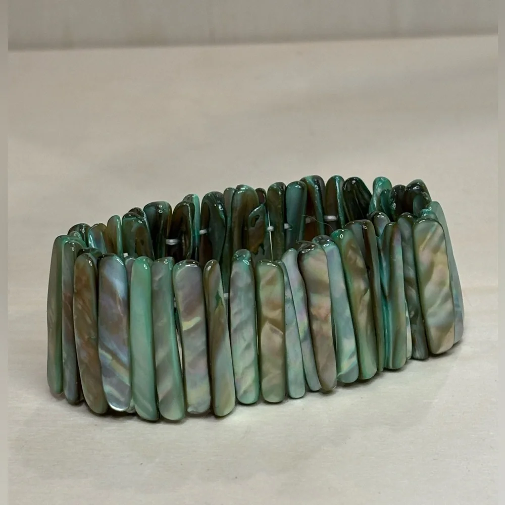 Mother of Pearl Abalone Shell light green shades panel stretch bracelet.